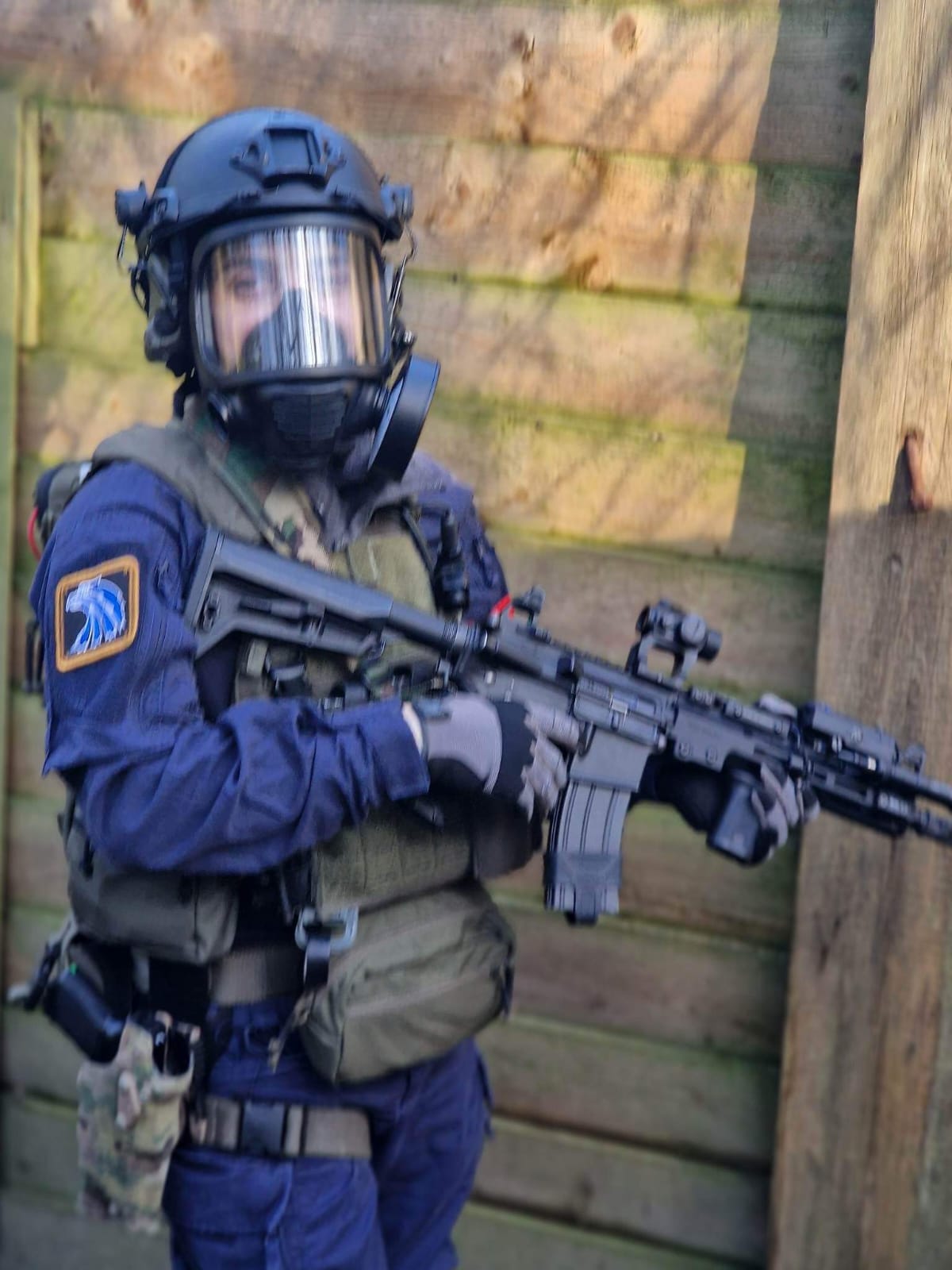A player in full face protection and camouflage ready to go on