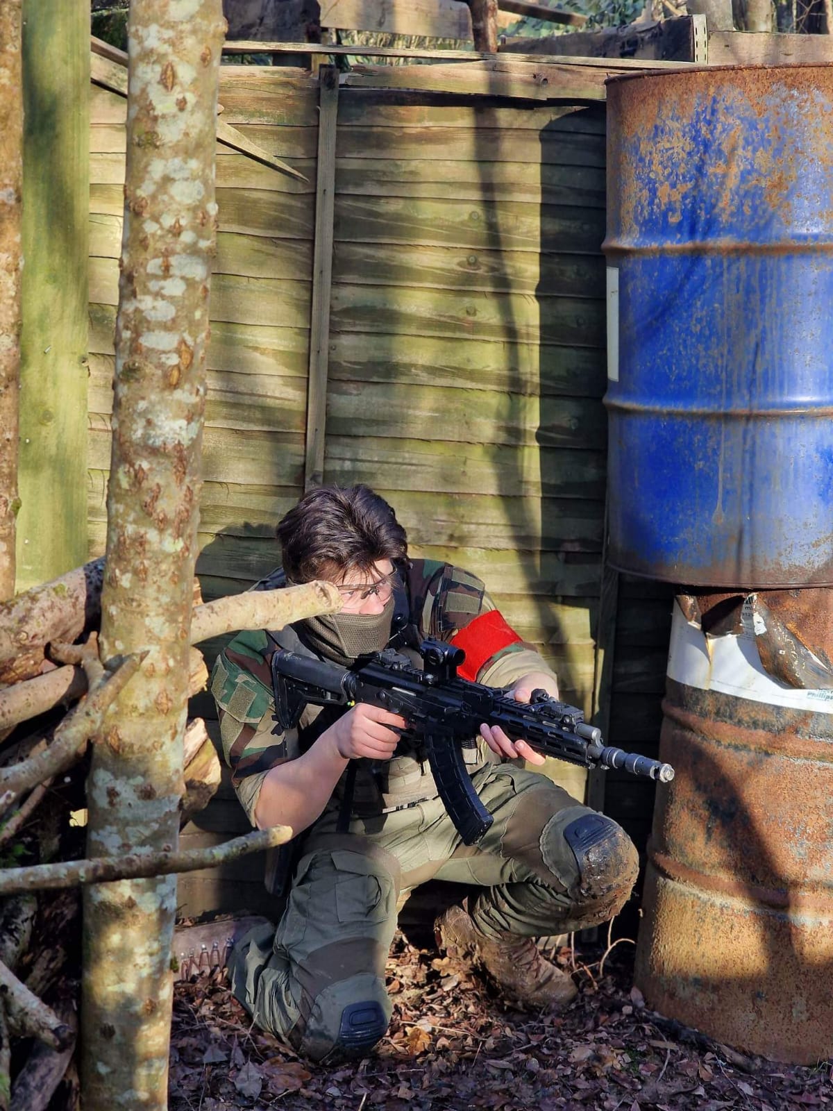 A player beside the oil drums on one of the fields
